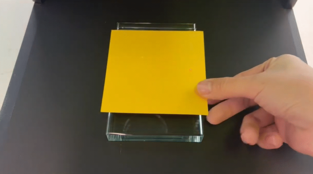 place a paper on the surface of the glass