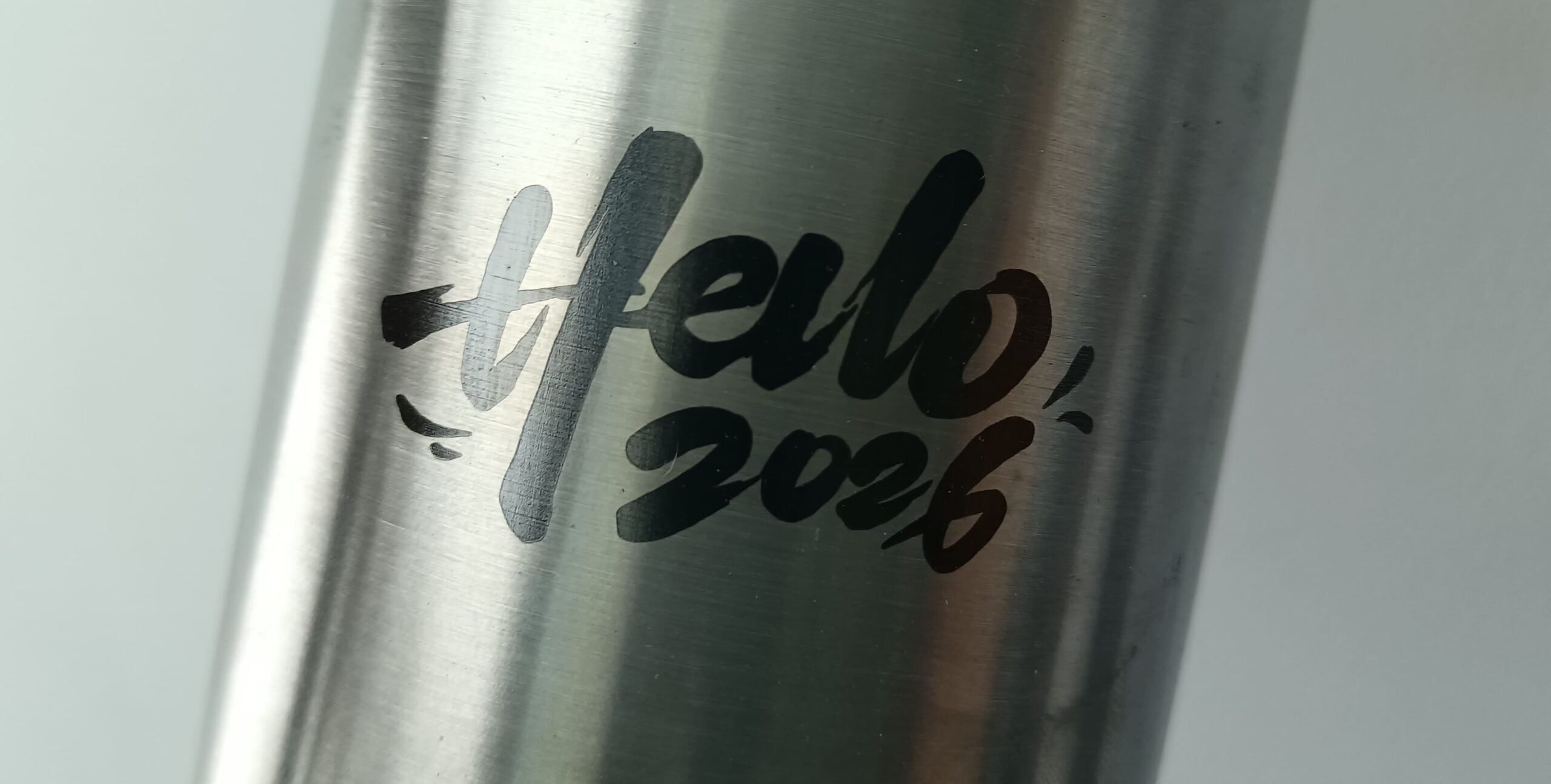 custom laser-engraved pattern on stainless steel motorcycle exhaust pipe