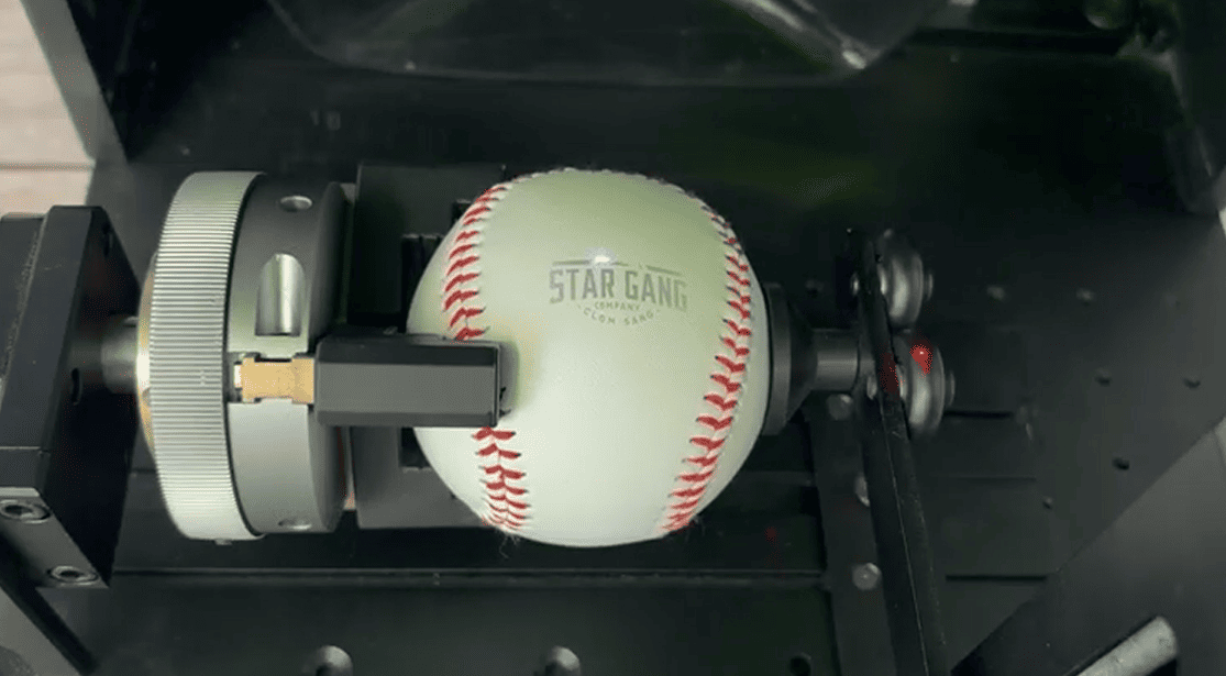 ComMarker Omni X laser engraving baseball with rotary attachment