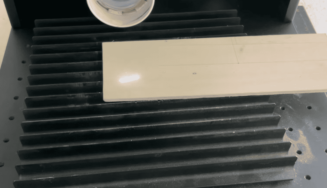 place a workpiece on the laser engraving bed