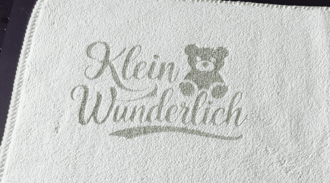 towel with bear logo engraved with UV laser engraver